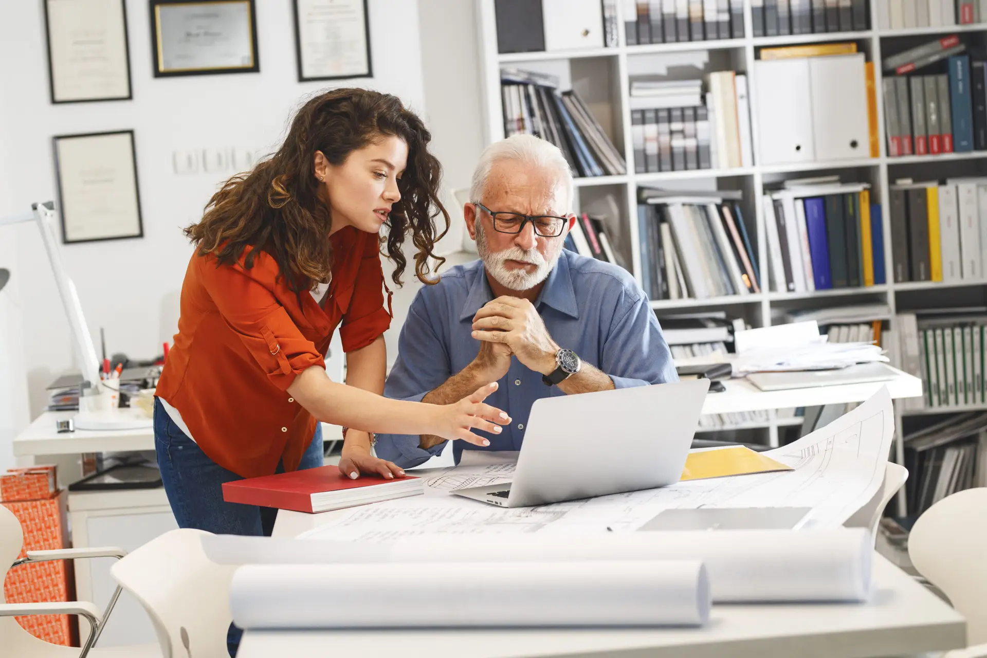 Architectural planning in the office, collaborative work on floor plans and designs